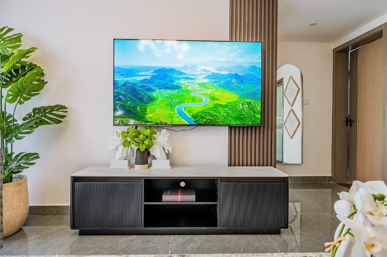 TV lounge with cozy seating in Riverside Nairobi apartment